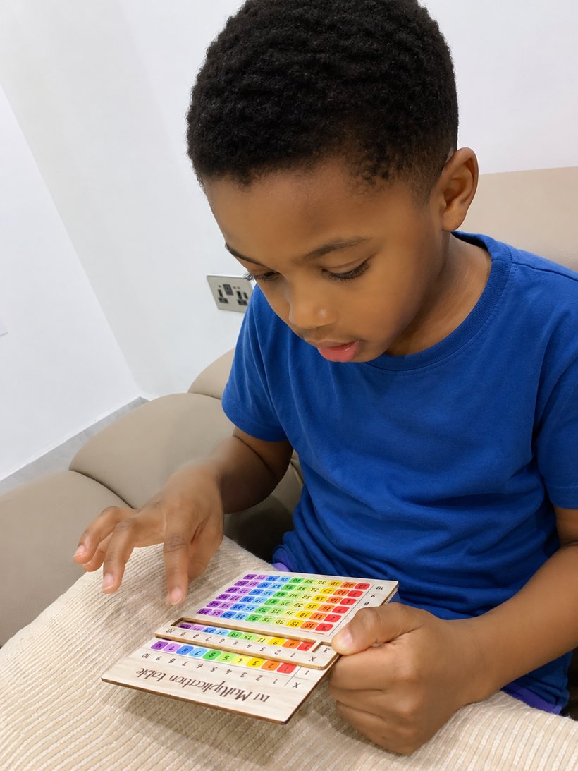 Child using a STEM multiplication puzzle